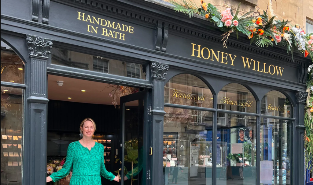 Indie Heroes - Rhiannon Hamilton Founder of Honey Willow in front of her shop, located on Pulteney Bridge, Bath
